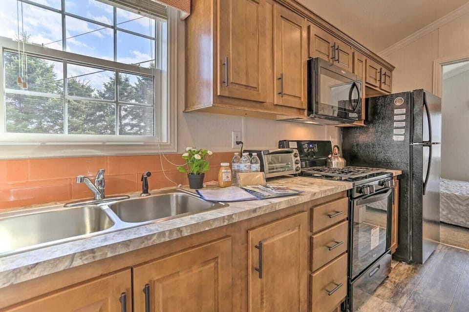 Sunlit kitchen with modern appliances and ample counter space