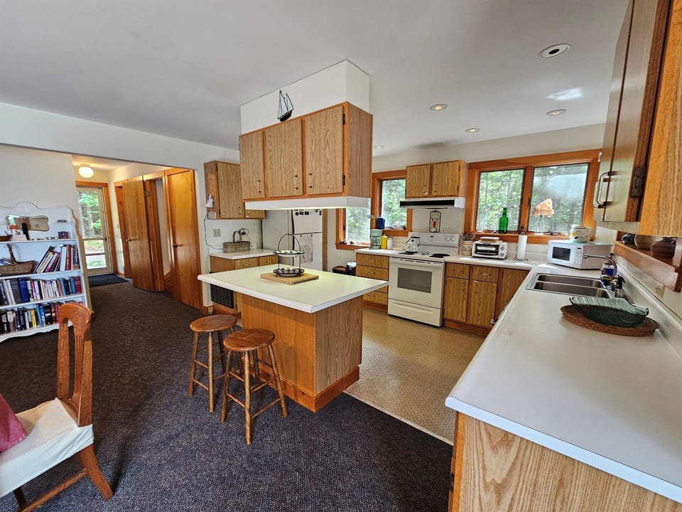 Kitchen with House Entrance in the distance