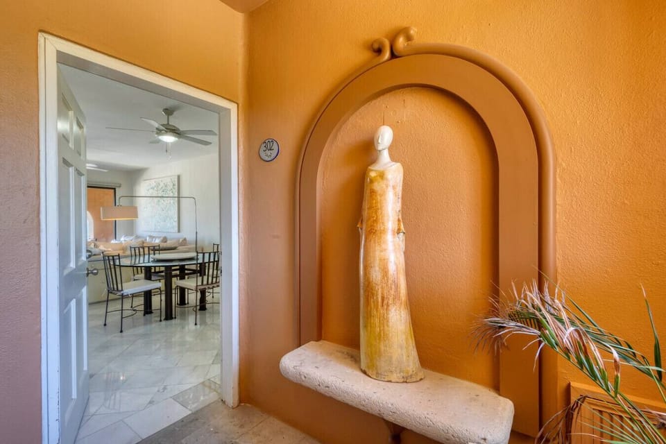 A stylish entryway with a unique art sculpture to welcome you into your beautiful vacation home.