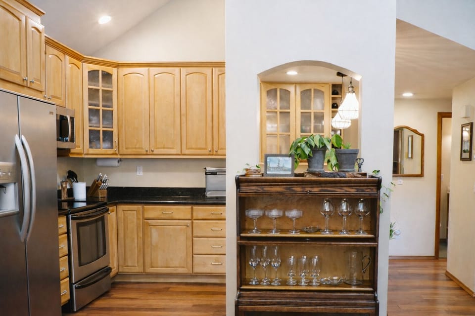 Variety of glassware. Kitchen has cozy radiant heated floors