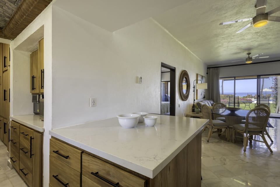 Enjoy the seamless flow from the kitchen island into the open-concept living and dining space.