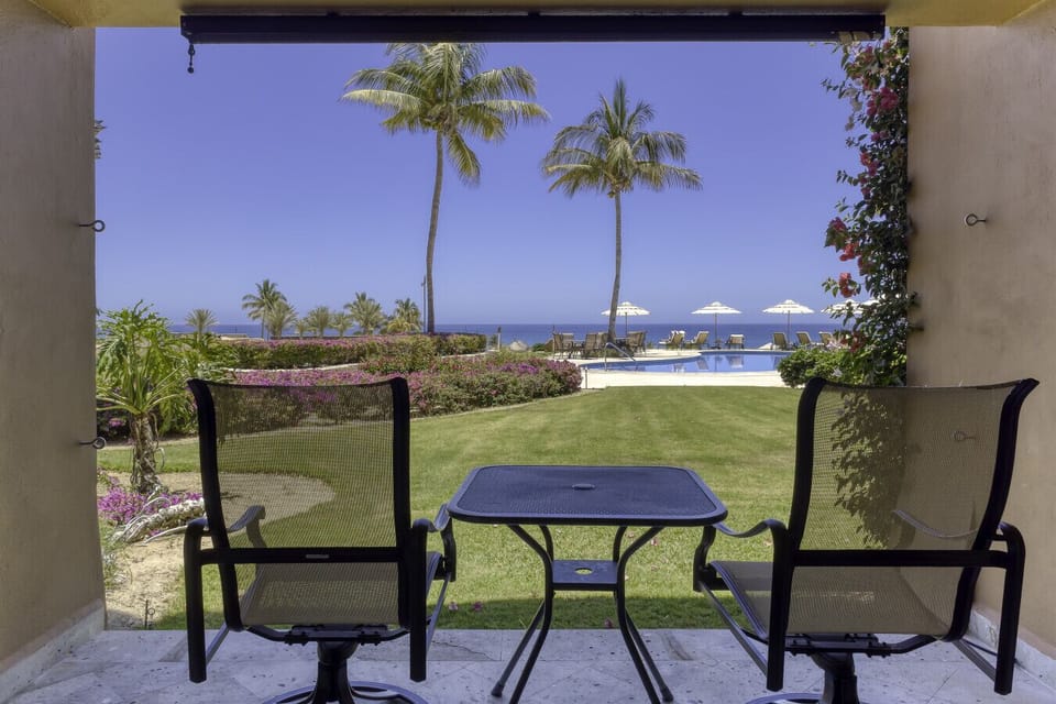 Enjoy grilling with a view! Modern stainless BBQ and dining area surrounded by greenery.