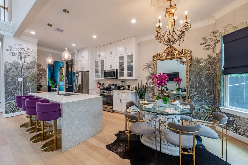 Designer kitchen & chic dining space with island seating and bold decor