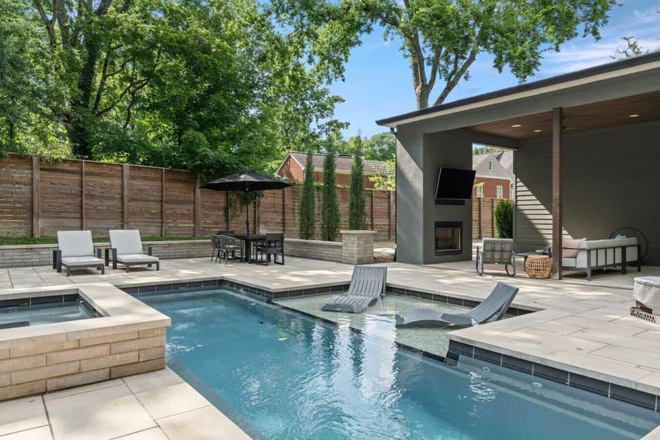 Enjoy a luxurious heated saltwater pool, relaxing hot tub, and rejuvenating sauna. Lounge on the spacious pool deck with comfortable sun chairs or enjoy a glass of wine in front of the smokeless Firepit.