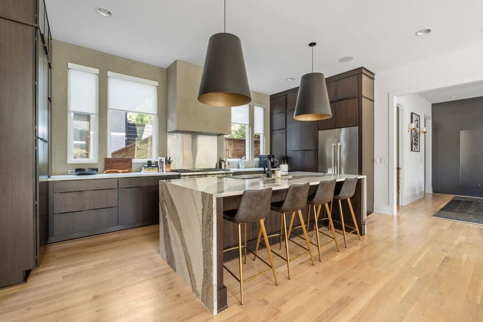 Fully equipped modern kitchen with high-end appliances, all the essentials for cooking and your morning coffee. Spacious island with seating for four.