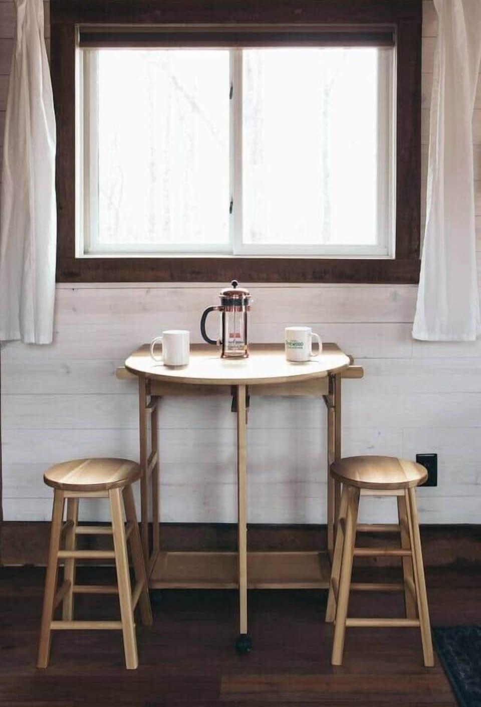 dining table opens to pull out two more stools