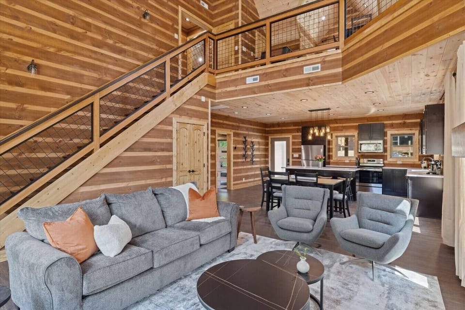 Open living area with electric fireplace, beautiful high ceilings and a smart TV!