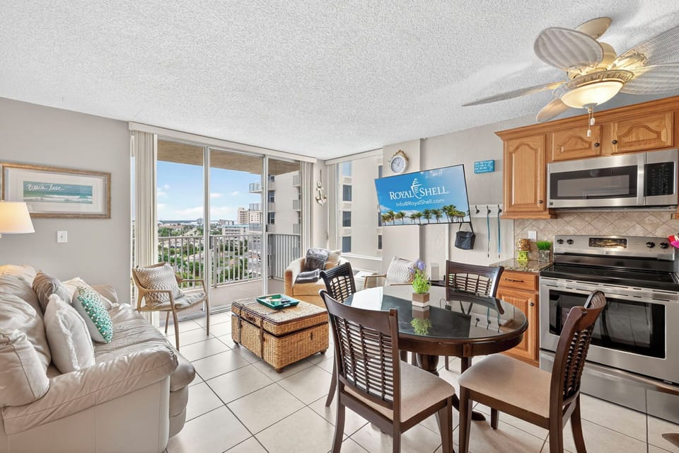 Bright and inviting studio at Estero Beach & Tennis Club featuring an open layout with a full kitchen, cozy living area, and comfortable sleeping space—perfect for a relaxing Fort Myers Beach getaway.