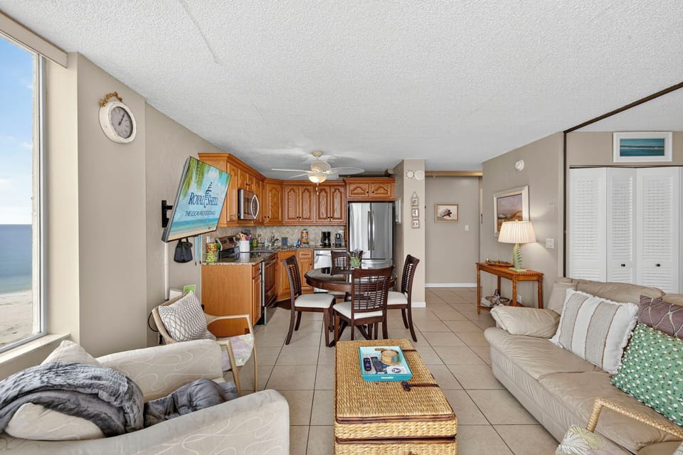 Bright and inviting studio at Estero Beach & Tennis Club featuring an open layout with a full kitchen, cozy living area, and comfortable sleeping space—perfect for a relaxing Fort Myers Beach getaway.