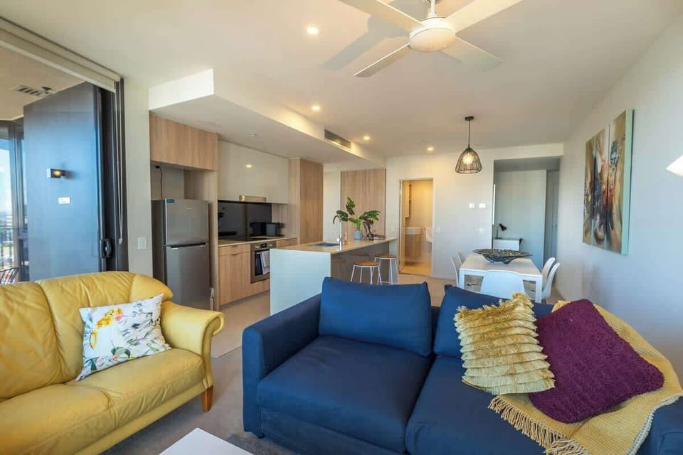 Open plan lounge/dining/kitchen.  The navy lounge does convert to a sofa bed.