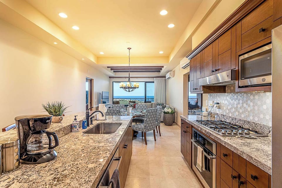 Fully equipped kitchen with granite countertops.