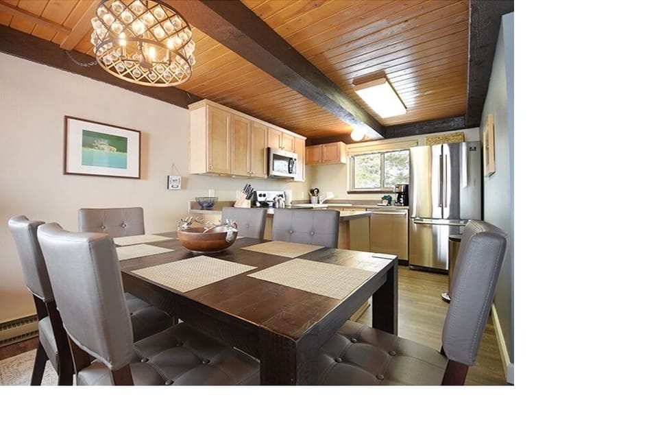 Cook, connect, and unwind in a bright open space with scenic mountain views.