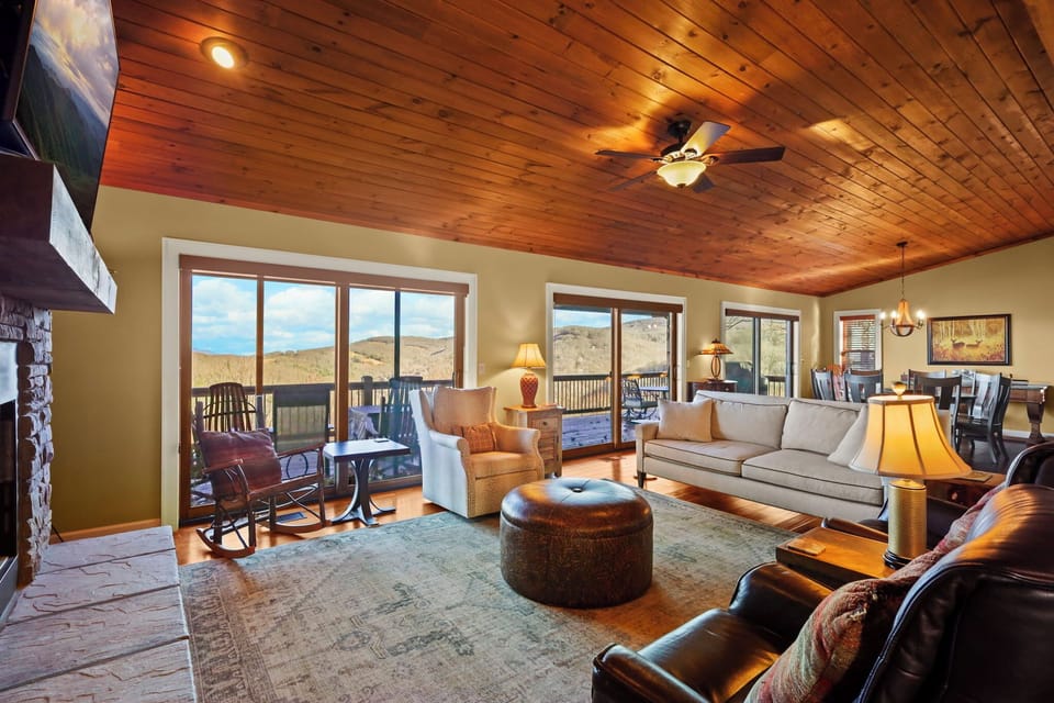 Bright living area with large windows framing stunning Beech Mountain views.