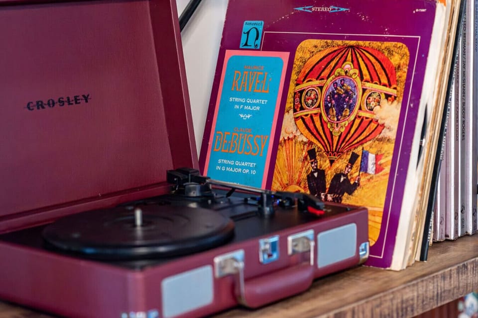 Vintage record player with curated vinyl collection for cozy, nostalgic listening