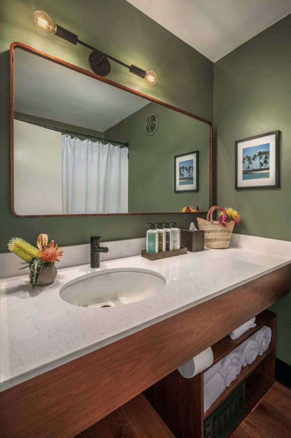 Refresh effortlessly at the sleek vanity with spa-like lighting.