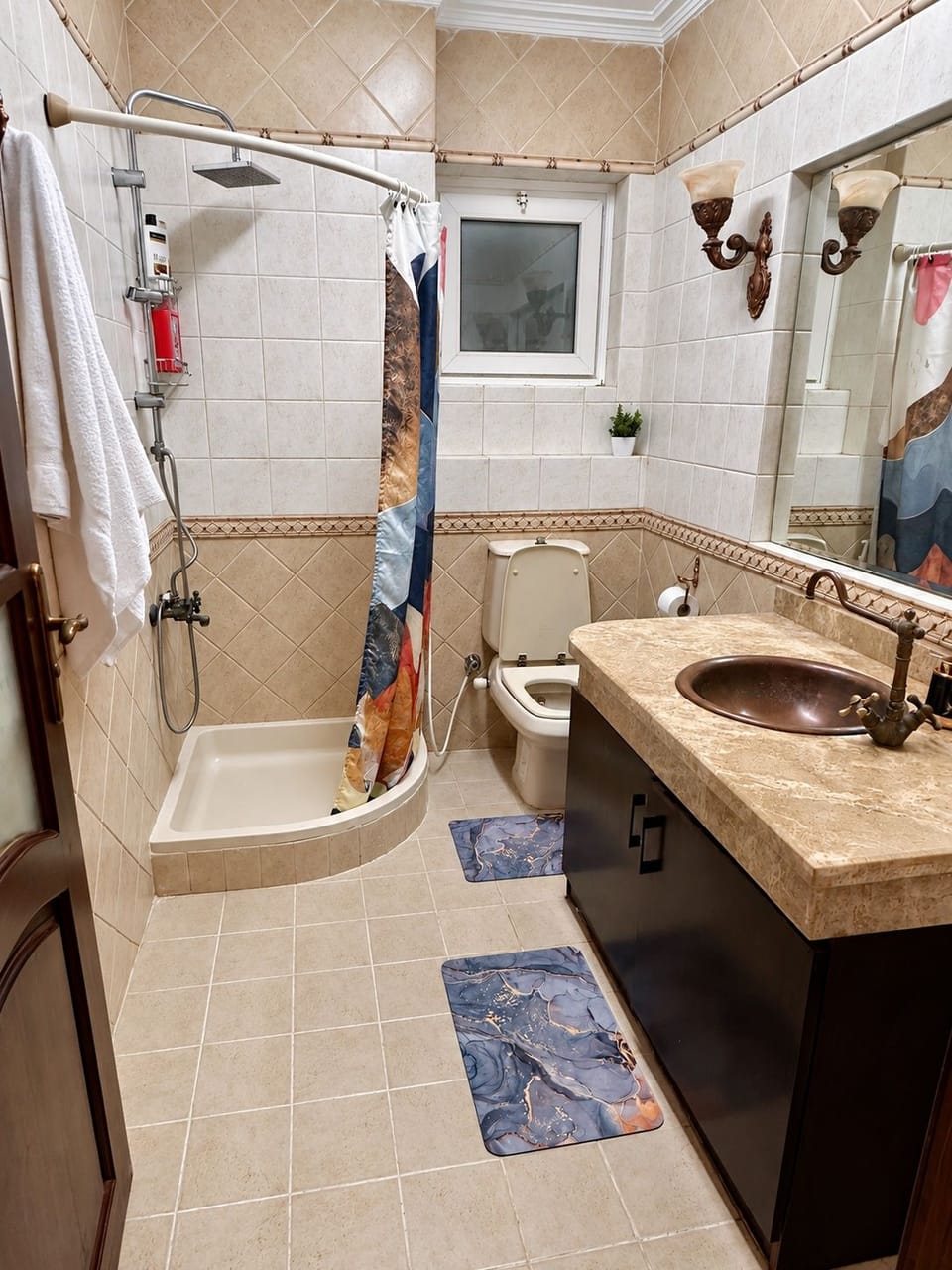 The second full bathroom has a separate shower area.