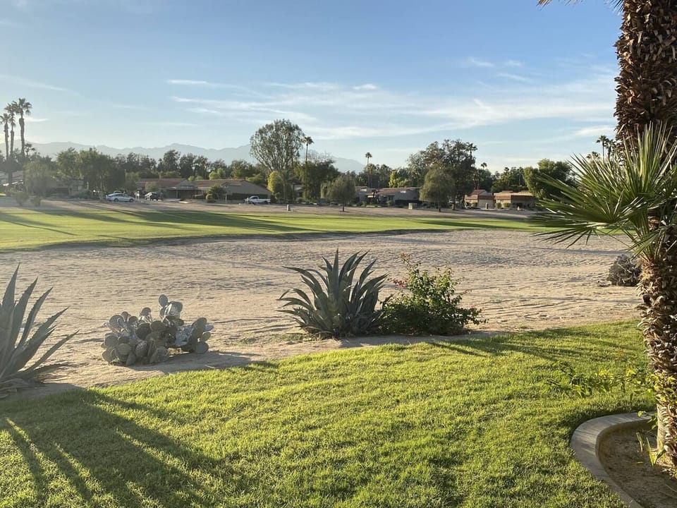 The west facing patio views of the 10th fairway with beautiful  mountains in the distance and ...