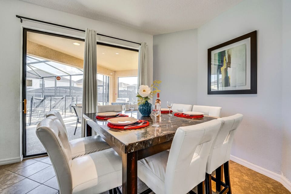 Cozy dining area overlooking the private pool deck.