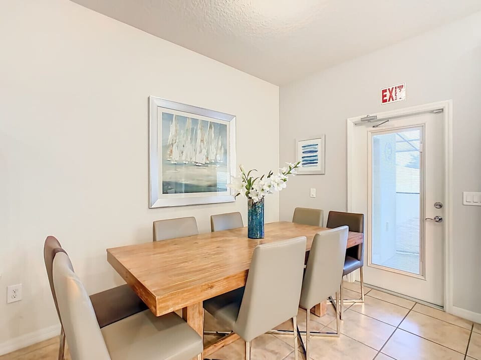 Elegant dining space with seating for six and a bright, airy atmosphere.