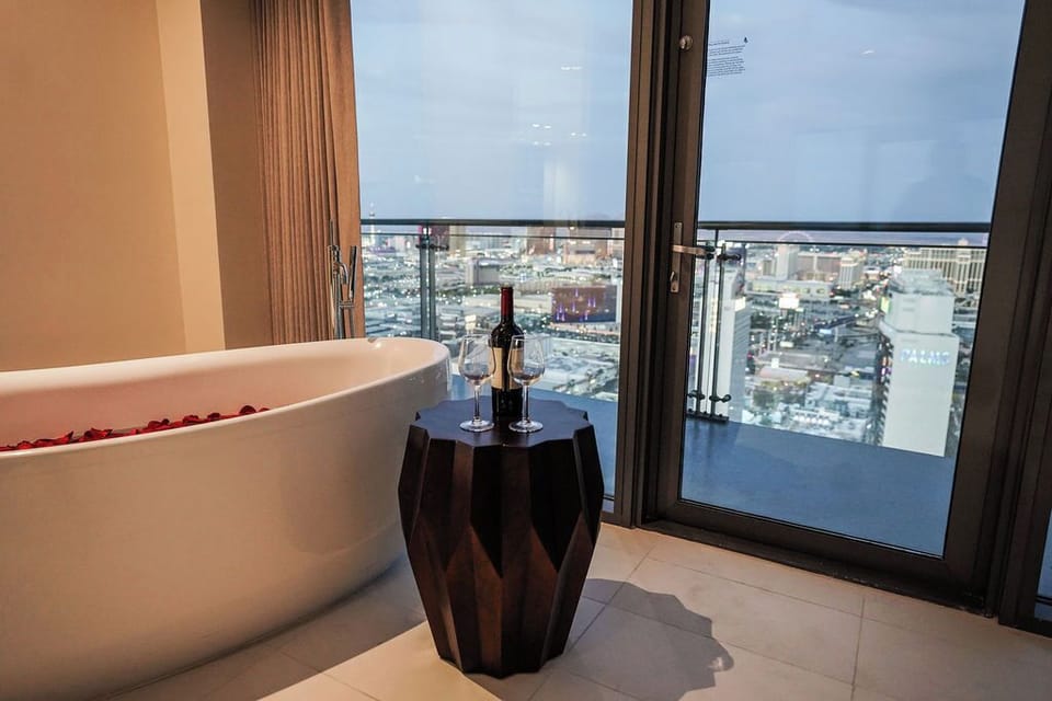 Breathtaking city skyline visible from the bed and the bath.