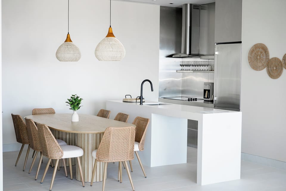 fully equipped kitchen with stylisyh dining table that comfortably seats six.