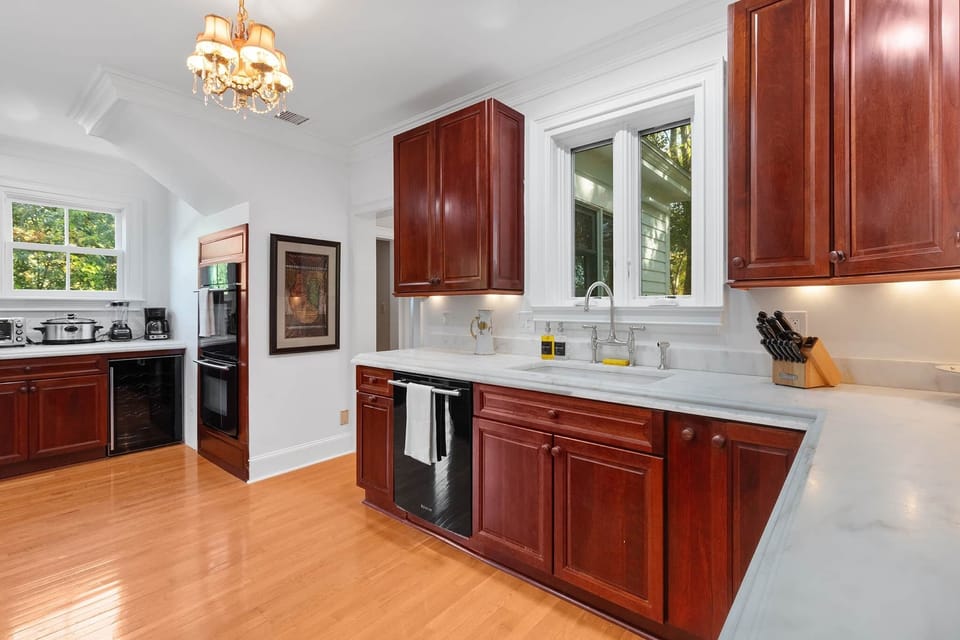 Fully stocked kitchen with two ovens and lots of natural light!