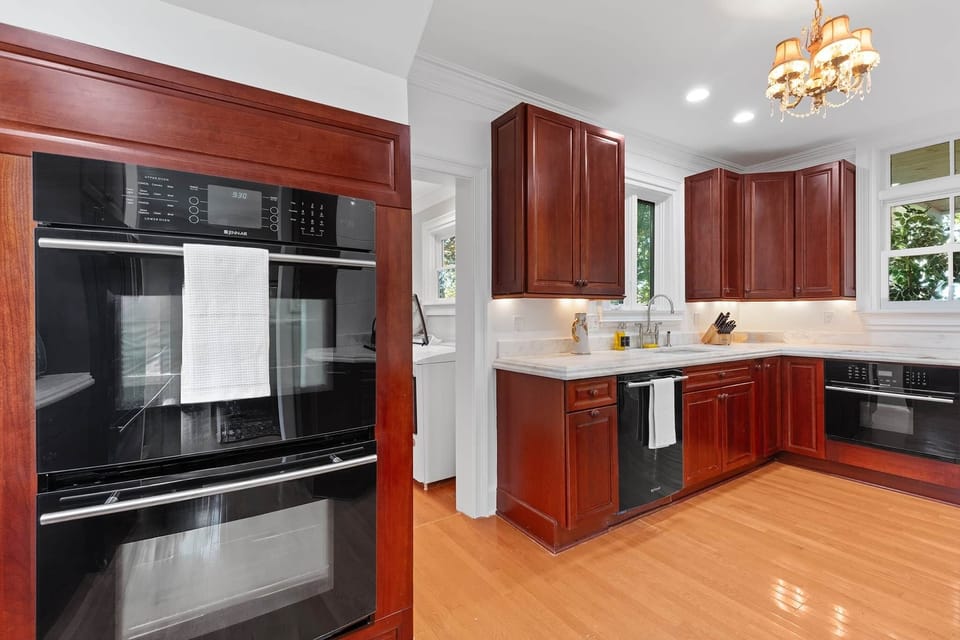 Fully stocked kitchen with two ovens and lots of natural light!
