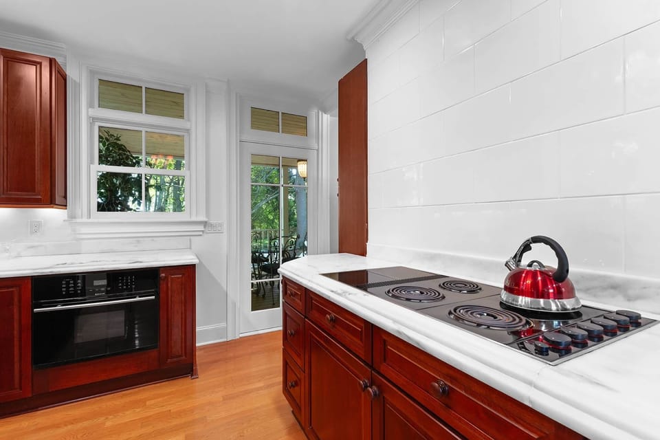 Fully stocked kitchen with two ovens and lots of natural light!