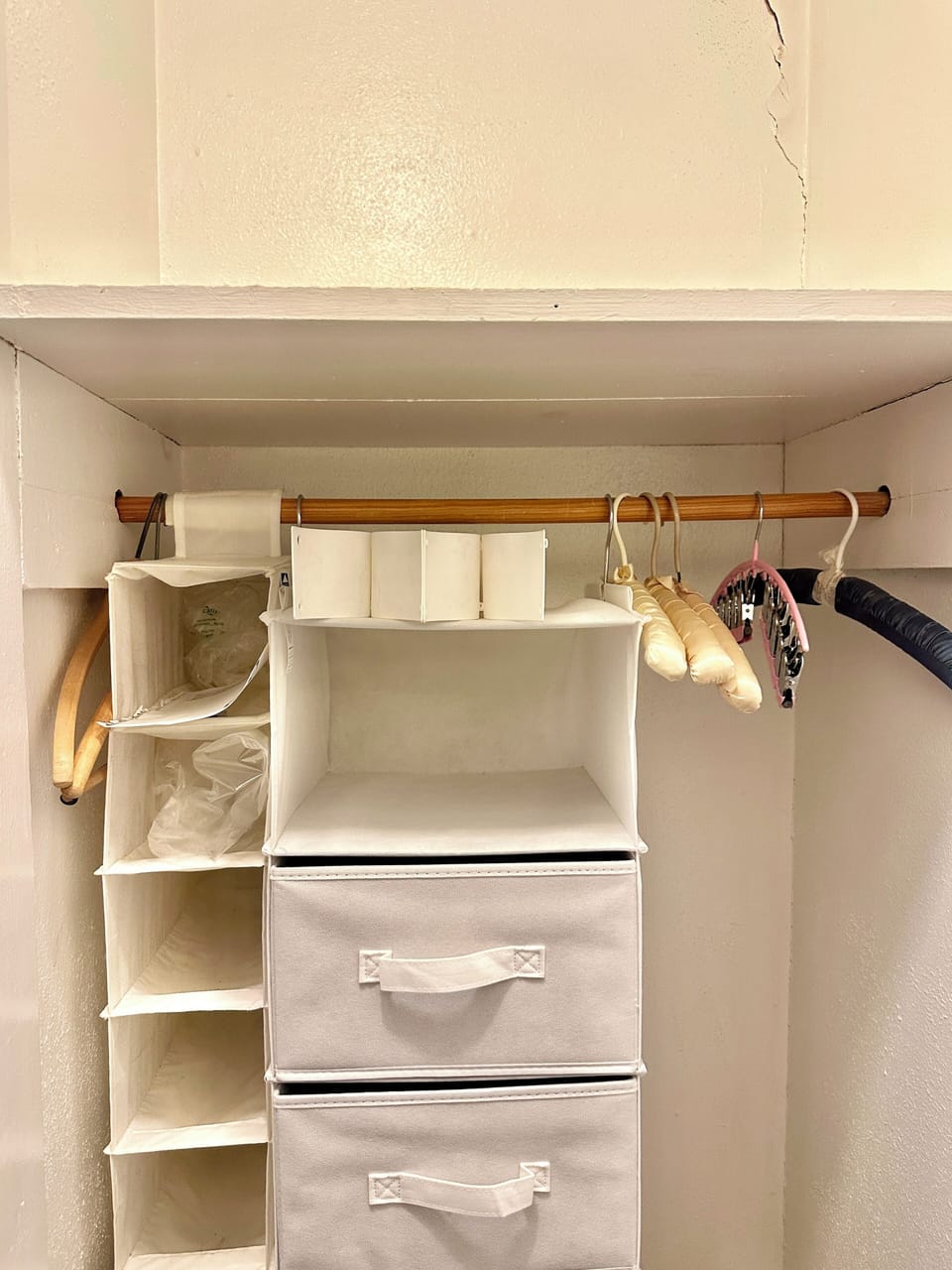 Bedroom clothes storage, plus shelves on both sides.
