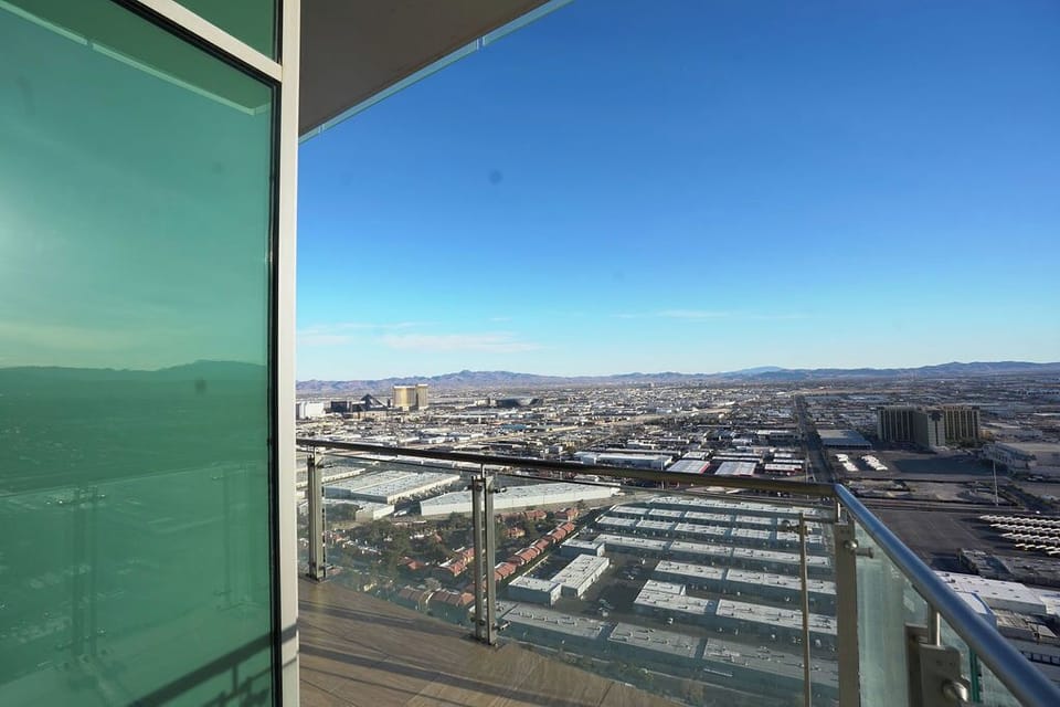 Watch the city light up from your high-rise sanctuary