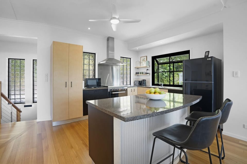 Fully equipped kitchen with gas stove and kitchen island