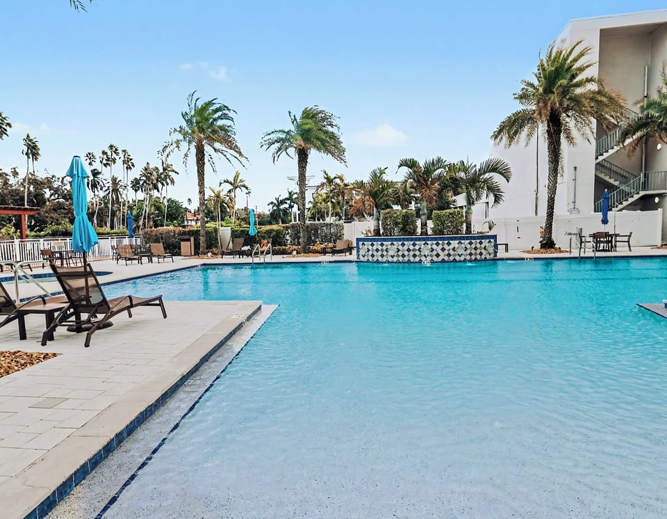 Fort Myers Pool: Sunny palm-fringed pool, tiled fountain, ample lounge seating