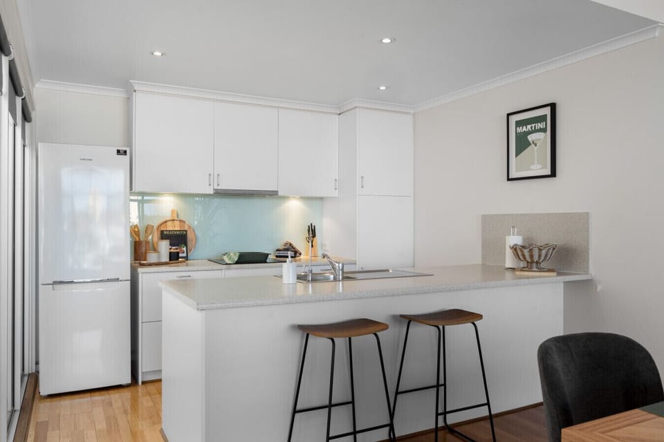 The kitchen centres around a spacious island with seating.