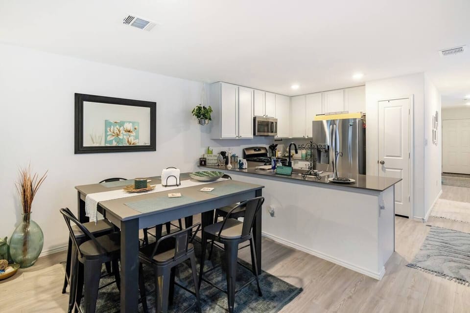 Functional and inviting dining area connected to the kitchen for easy serving.