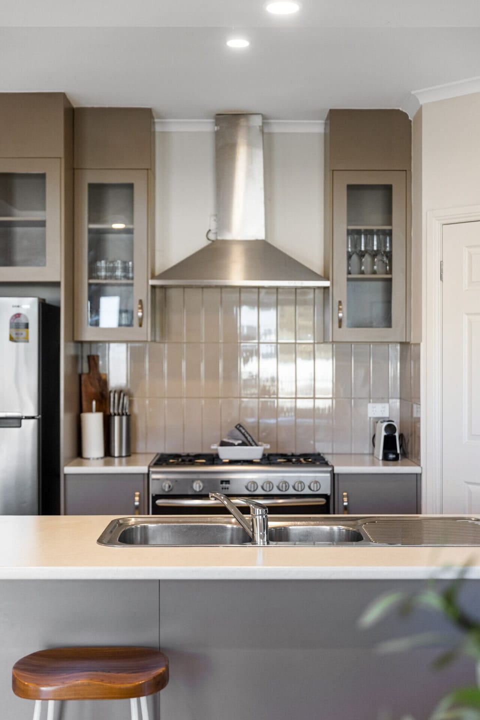 Start your day at the breakfast bar with a fresh coffee, perfect for easy mornings and casual bites.