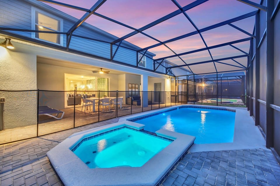Peaceful pool area with a shaded lanai