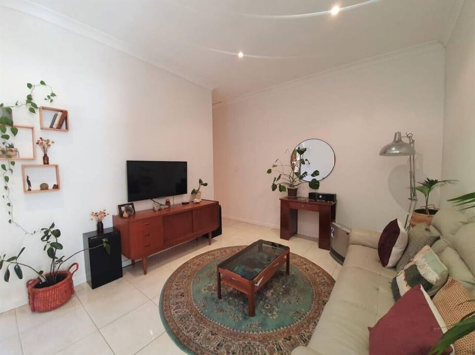 Settle in for a relaxed evening with your favourite show, where the TV is perfectly positioned within a warm, character-filled space.