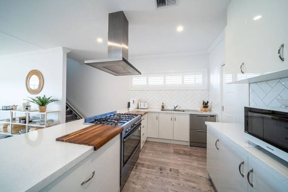 Prepare meals with ease in the fully equipped kitchen designed for everyday convenience.