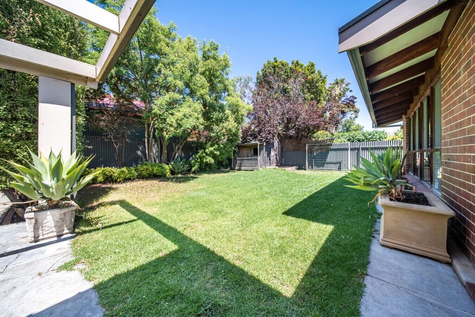 Stretch out on the lawn and enjoy open-air relaxation in a spacious, private backyard.