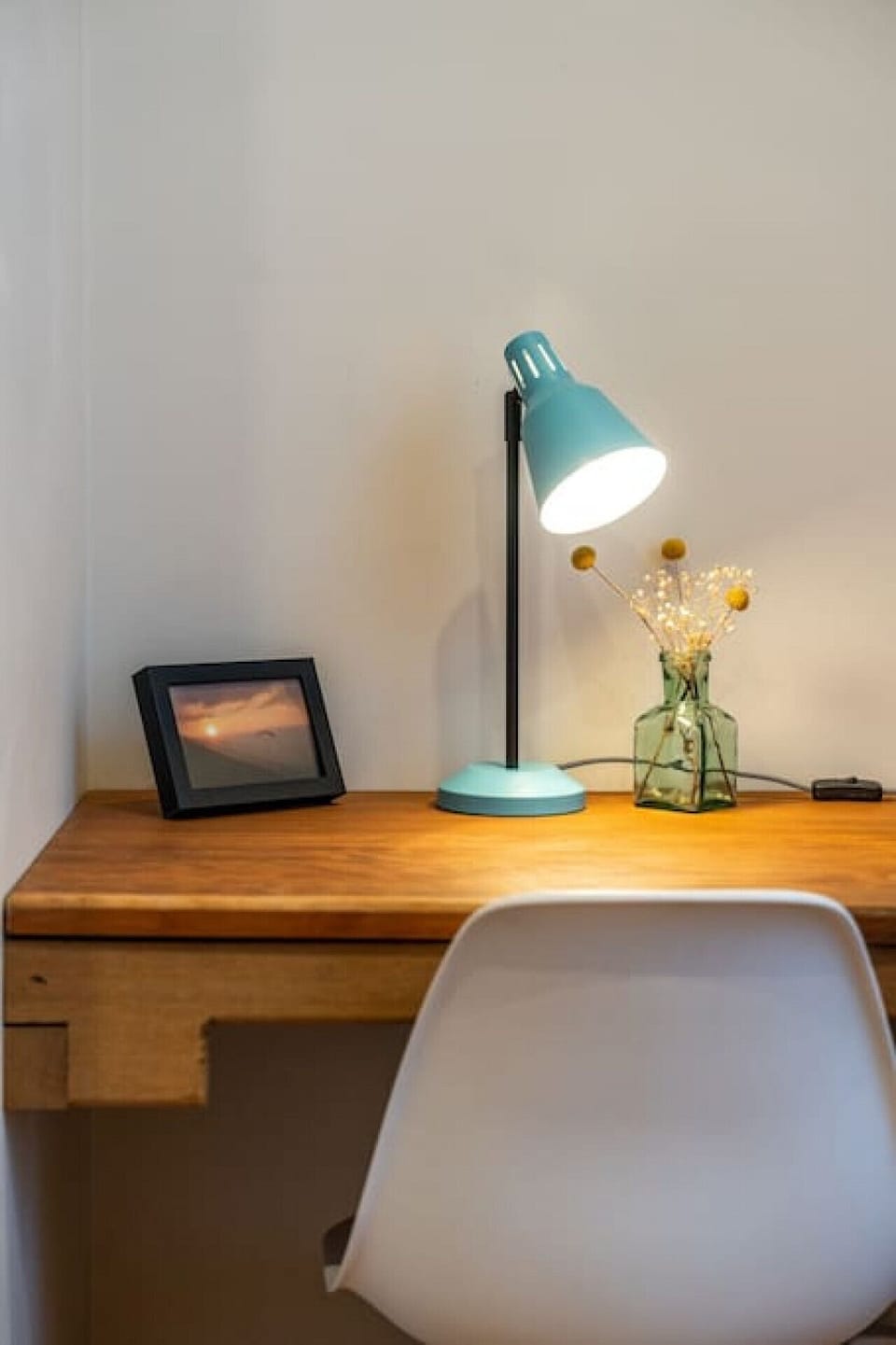 A desk offers space for remote work or study.