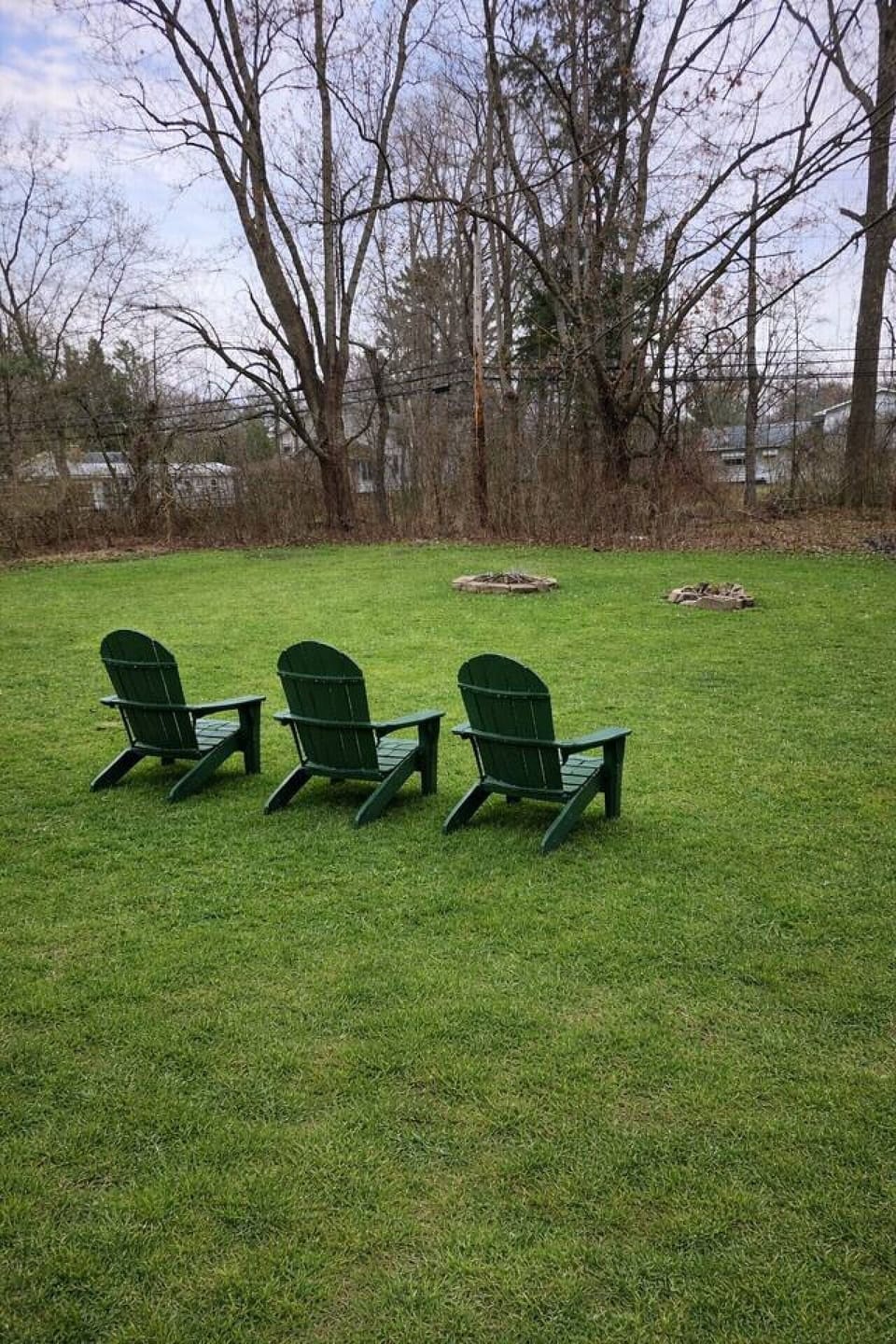 Backyard with seating and fire pit.