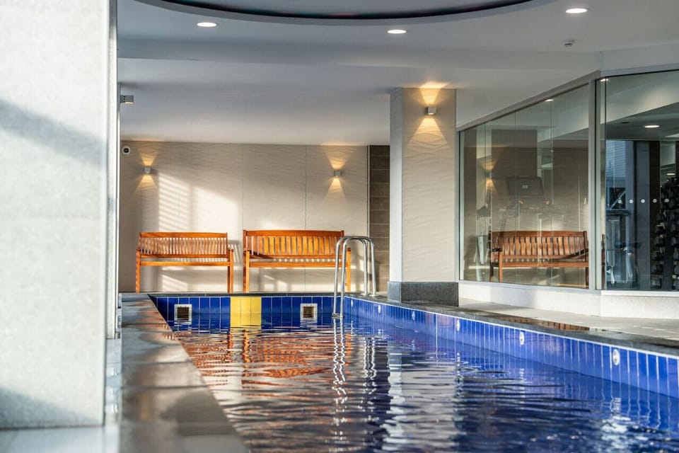 Unwind with a swim in the shared indoor pool after a day exploring.