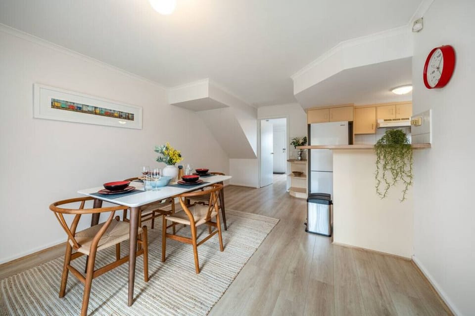 The dining area and kitchen flow together seamlessly, creating a welcoming space for easy entertaining.