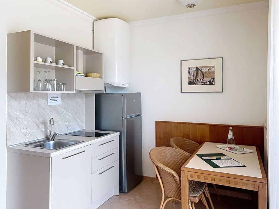 Furniture, Interior Design, Wood, Flooring, Floor, Room, Major Appliance, Table, Countertop, Kitchen