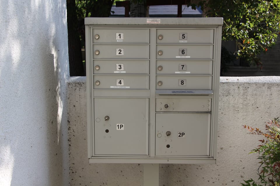 Secure exterior mailboxes with package delivery boxes.