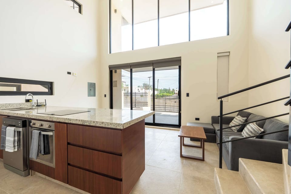 Kitchen in Double Height Ceiling Living Area