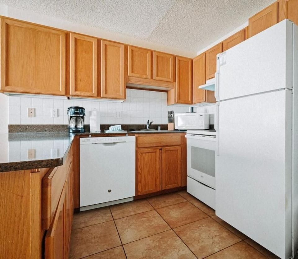 Prep and dine comfortably with generous counters and bright cabinetry.