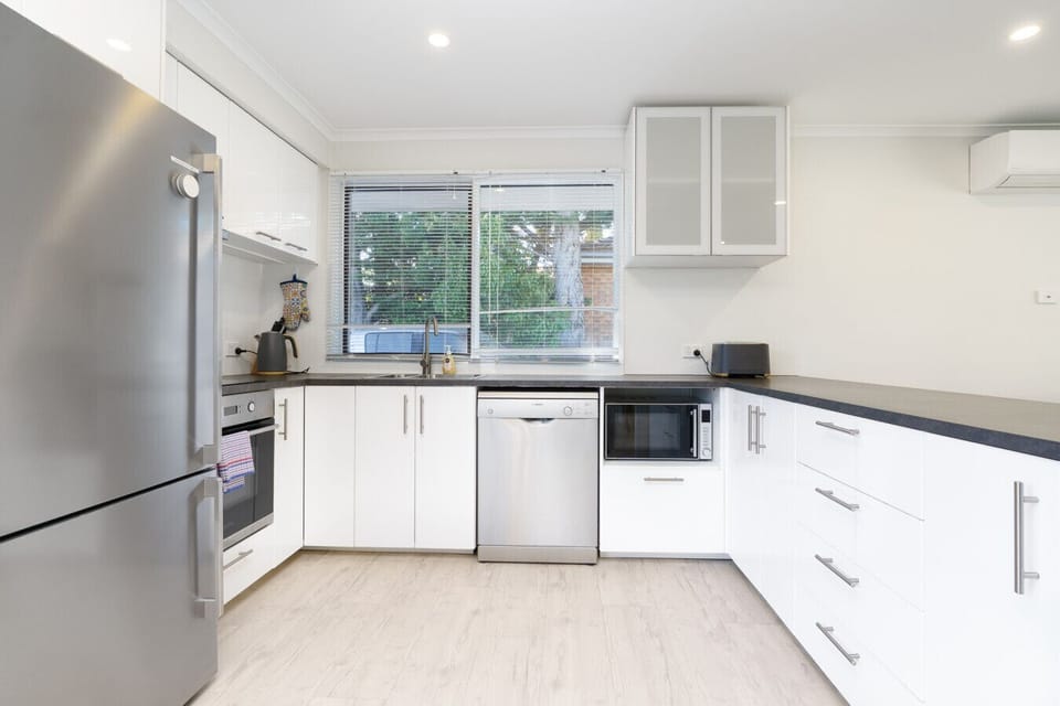 Bright, minimalist kitchen blending style and everyday practicality