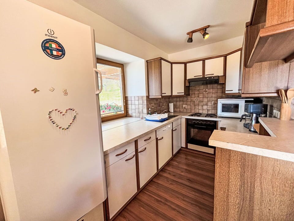 Wood, Interior Design, Flooring, Floor, Furniture, Countertop, Cabinetry, Room, Wood Stain, Kitchen