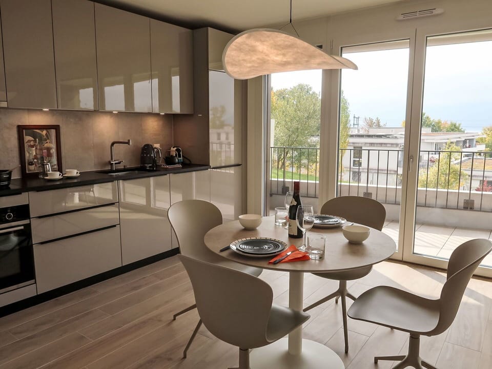 Furniture, Interior Design, Flooring, Kitchen, Wood, Floor, Ceiling, Countertop, Light Fixture, Kitchen & Dining Room Table